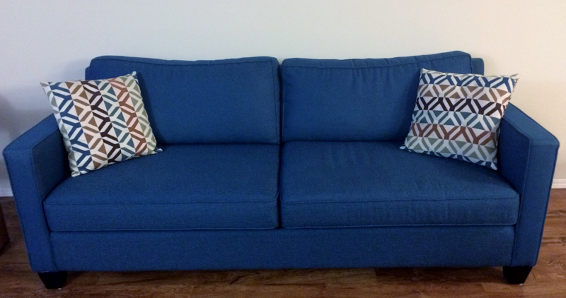 Blue couch with pillows