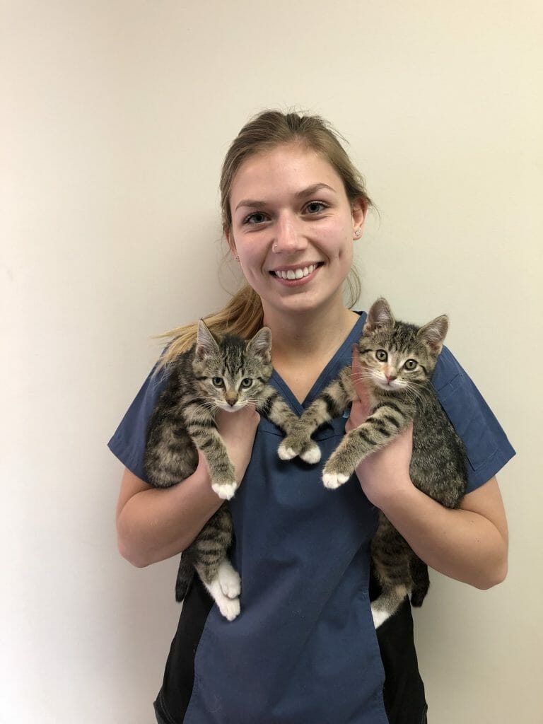 Jade Bencharsky holding two kittens